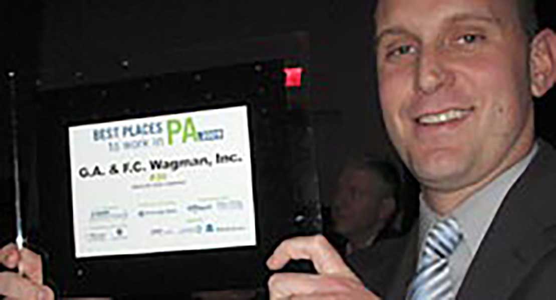 Mike Glezer accepts the Best Places to Work award