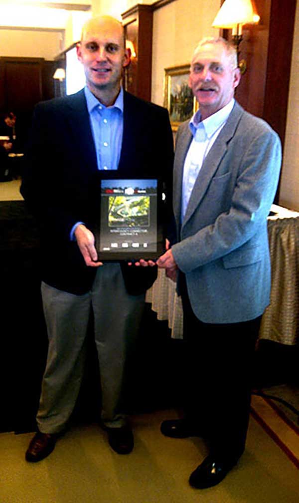 Mike Glezer and Todd Becker accept the ENR award